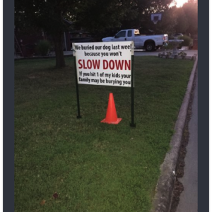 After dog gets hit by car, brutal sign has entire neighborhood talking