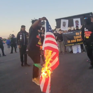 WATCH: Communists Crash Jason Aldean Concert, Burn American Flags